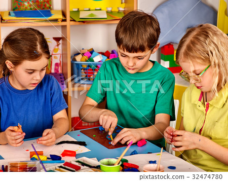 Small students girl painting in art school class. Small students girl painting in art school class. 32474780