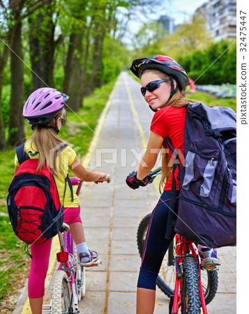 Bicycle path sign with children. Girls wearing 32475447