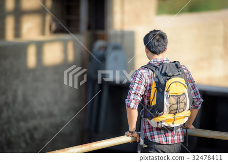 Backpackers are touring the floodgates. 32478411