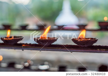 Coconut oil lamps in temple Coconut oil lamps in temple 32480410