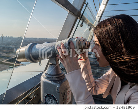 Tourist look observant binoculars telescope on panoramic view 32481909