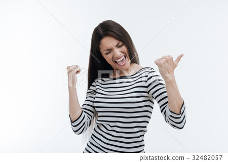 Satisfied young woman expressing positivity 32482057