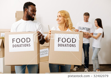 Admirable young people happy volunteering 32482079