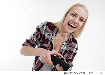Beautiful blonde expressing positivity while 32482131