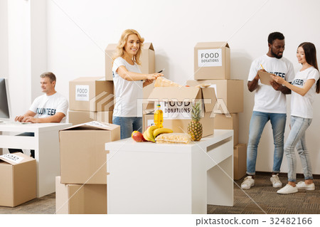 Observant brilliant lady counting the supplies 32482166