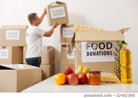 Nice admirable guy checking the boxes in a 32482308