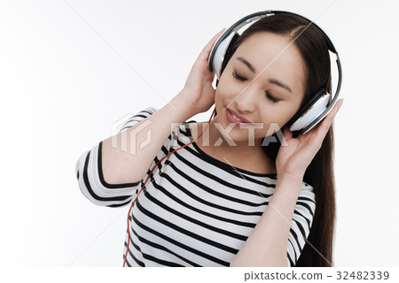 Beautiful girl relaxing while listening music 32482339