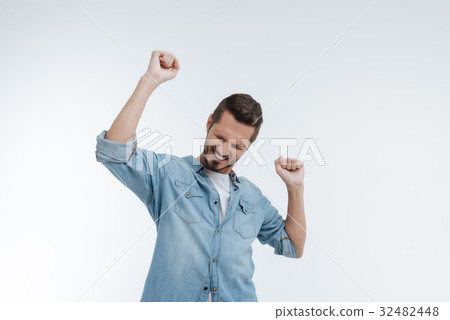 Delighted brunette being very glad while became 32482448