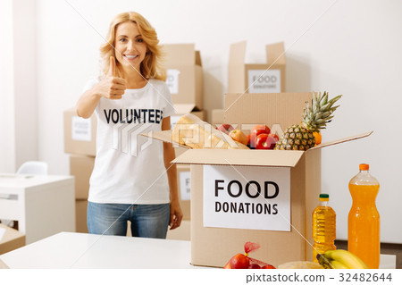 Admirable lively woman collecting a parcel 32482644