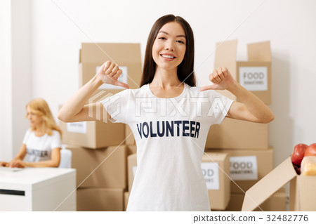 Energetic young woman proud of her work 32482776