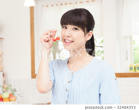 A woman with cherry 32484353