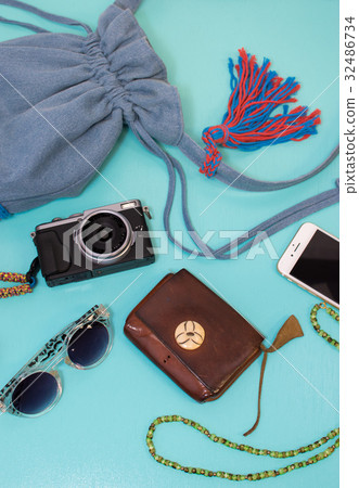 Bag's content Light blue background Bag's content Light blue background 32486734