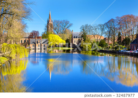 Lake in Bruges, Belgium, church and medieval 32487977