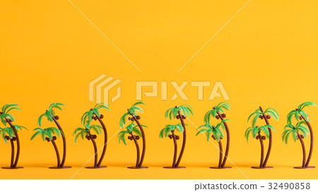 Little palm trees on a yellow background Little palm trees on a yellow background 32490858