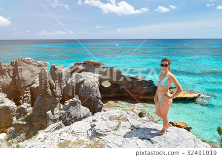 women in sunglasses and bikini 32491019
