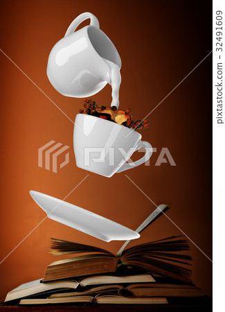 Milk being poured into small cup of coffee. 3d Milk being poured into small cup of coffee. 3d 32491609