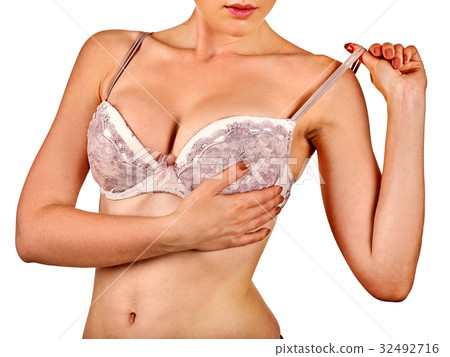 Breast self exam of women. Woman wearing bra. 32492716