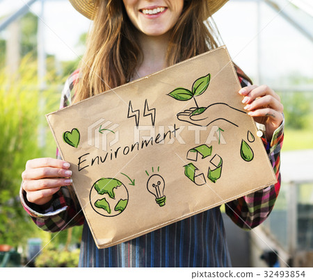 Farmer woman holding go green banner 32493854