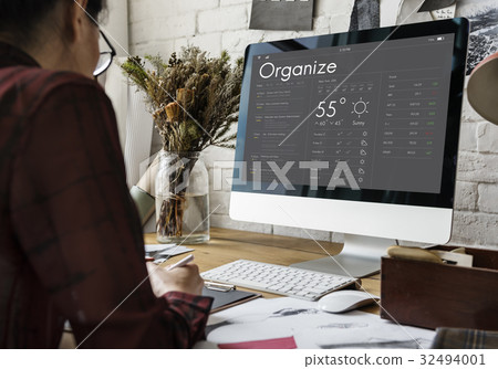 Woman checking appointment on personal organizer schedule Woman checking appointment on personal organizer schedule 32494001