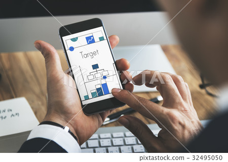 Man working on digital device network graphic overlay 32495050