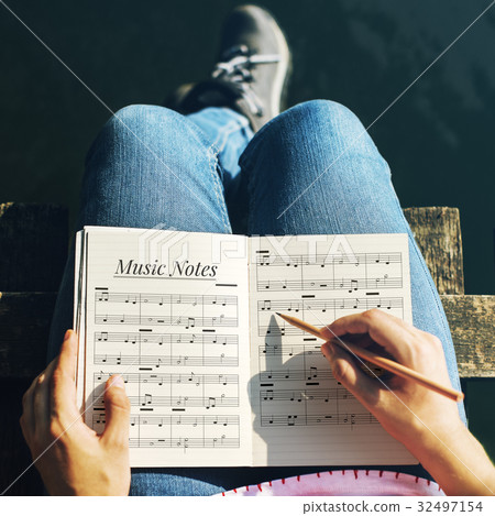 Hands working on notebook network graphic overlay 32497154