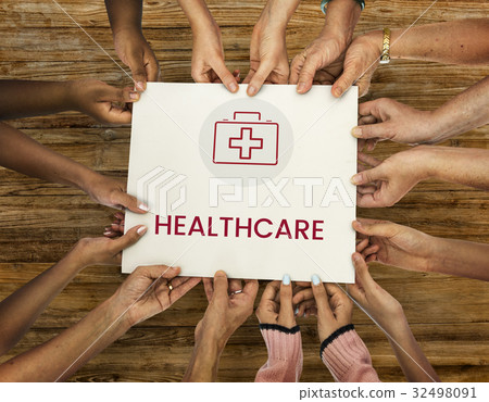 Diverse hands hold healthcare concept card 32498091