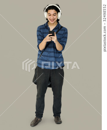 Young man full boady listening music on smart phone 32498552