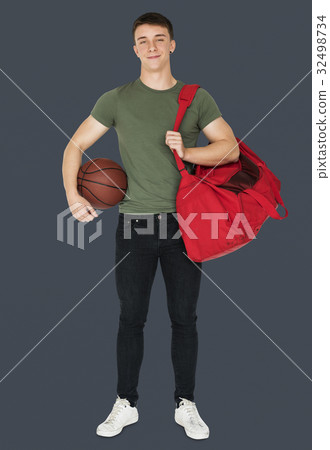 Young adult muscular man holding basketball Young adult muscular man holding basketball 32498734