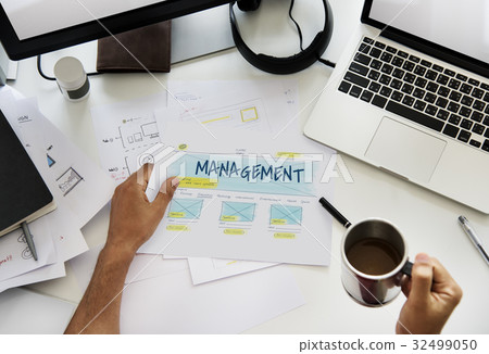 Hand working on paper network graphic overlay Hand working on paper network graphic overlay 32499050