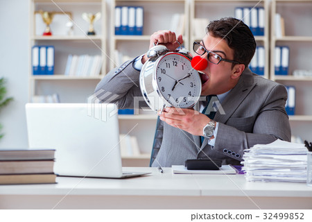 Clown businessman with alarm clock missing 32499852