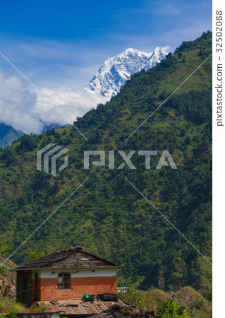 House with mountain landscape in annapurna, Nepal. 32502088