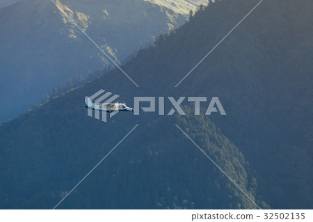 The plane flying among the Himalaya mountains. The plane flying among the Himalaya mountains. 32502135