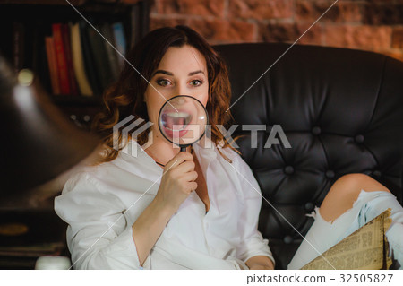 funny woman smiling and show teeth through a 32505827