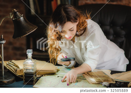 funny woman looking through a magnifying glass to funny woman looking through a magnifying glass to 32505889