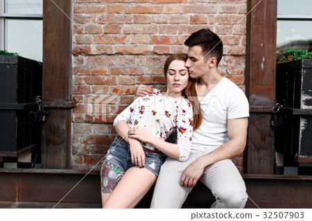 Portrait of young modern couple in love, posing Portrait of young modern couple in love, posing 32507903