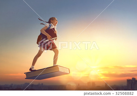 child flying on the book child flying on the book 32508882