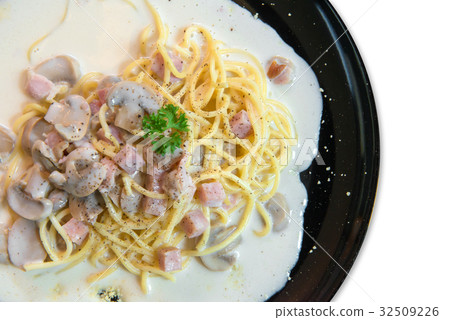 spaghetti with Mushroom sauce on black dish 32509226