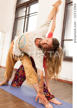 Man and woman practicing partner yoga 32513869