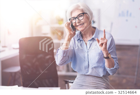 Busy ambitious businesswoman asking to hold on Busy ambitious businesswoman asking to hold on 32514664