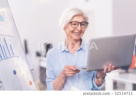 Lively inspiring business lady making a video call 32514711