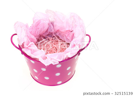 Polka dots bucket and peach colored paper packing Polka dots bucket and peach colored paper packing 32515139