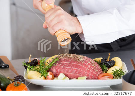 Chef preparing a dish 32517677