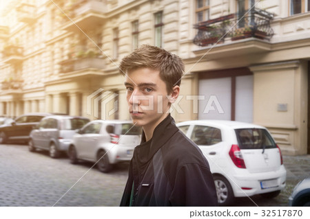 portrait of a young man on the street portrait of a young man on the street 32517870