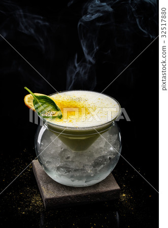 Exotic alcoholic cocktail on a dark background. 32517880