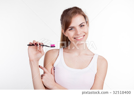 girl shows the finger on the toothbrush smile girl shows the finger on the toothbrush smile 32518400