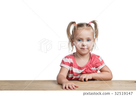 Sweet preschool girl at a desk 32519147