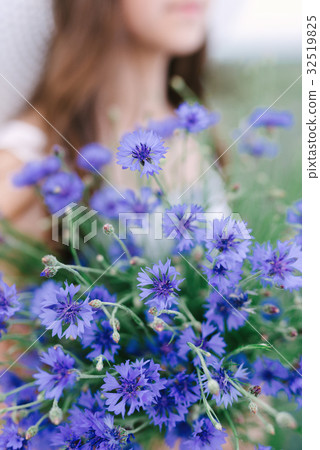 Girl with a bouquet of lavender Girl with a bouquet of lavender 32519825