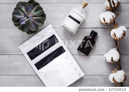 Coconut oil, woman body coffee scrub on gray Coconut oil, woman body coffee scrub on gray 32520018