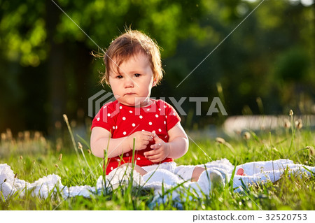 cute adorable nice baby girl in red spring dress cute adorable nice baby girl in red spring dress 32520753