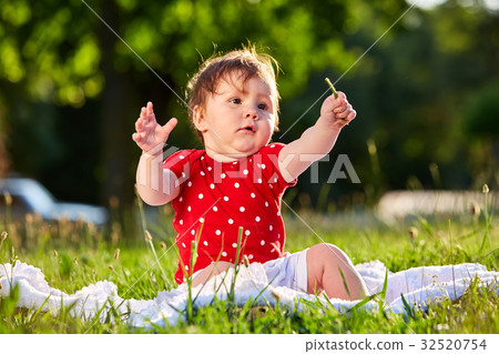 cute adorable nice baby girl in red spring dress cute adorable nice baby girl in red spring dress 32520754